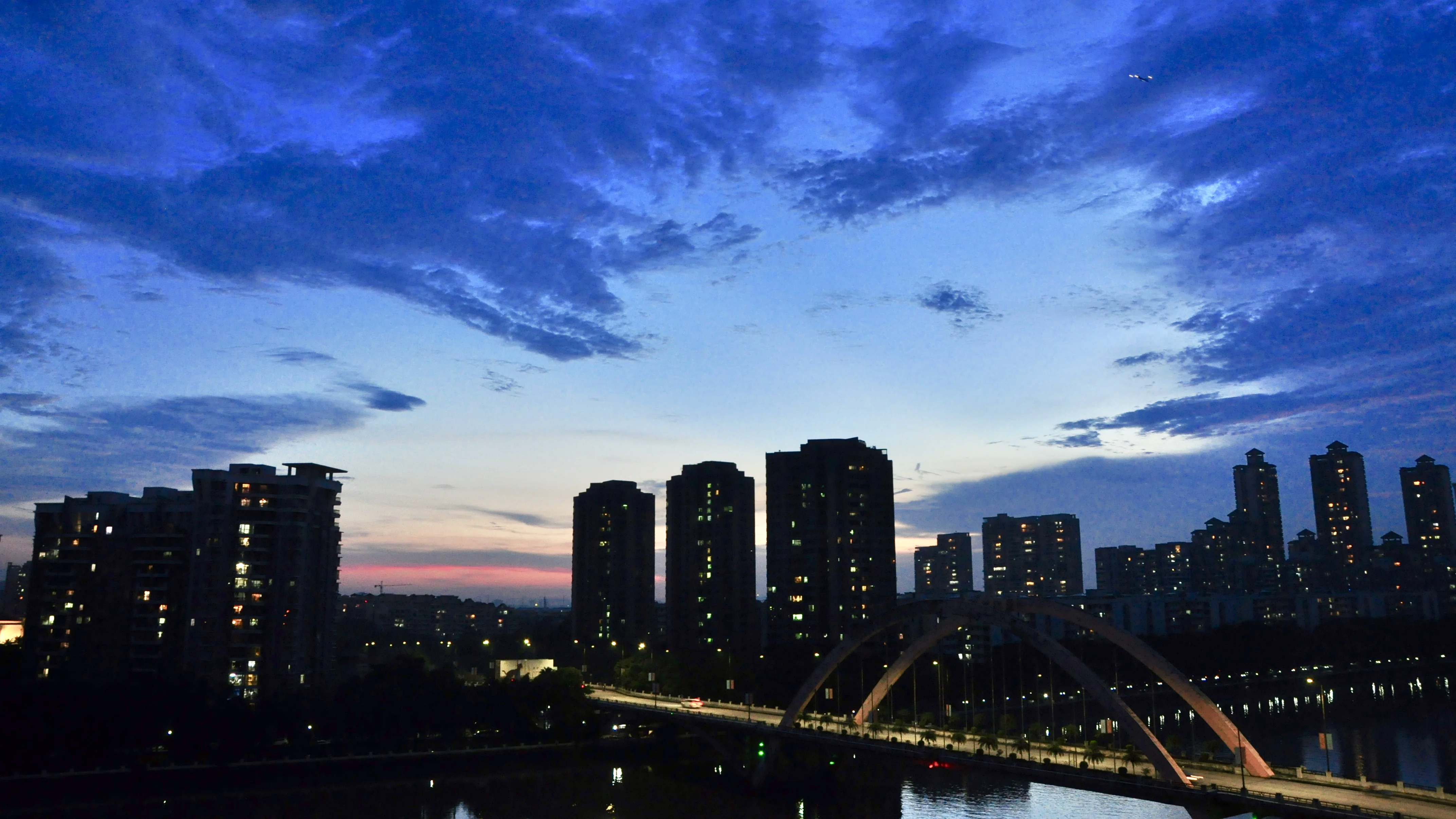 Guangzhou skyline and bridge at blue-hour dusk.