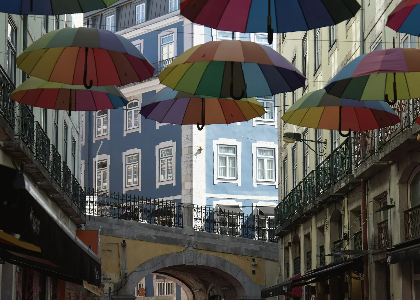 Colourful umbrellas over a Lisbon street.