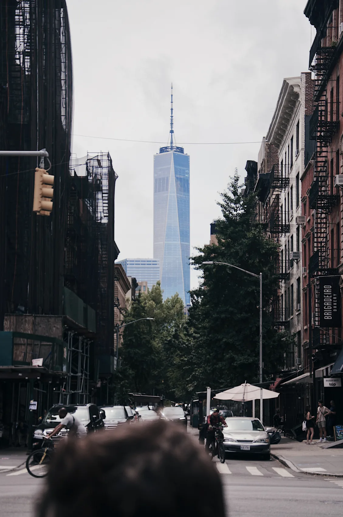 One World Trade Center at the end of a narrow New York street.