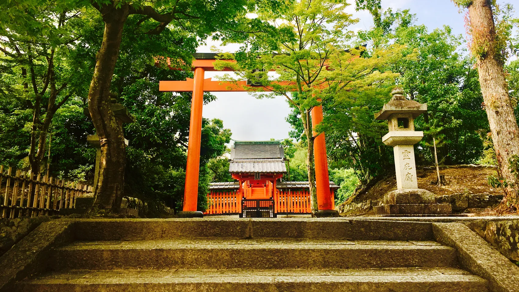 A shrine gate and stone steps in Osaka.