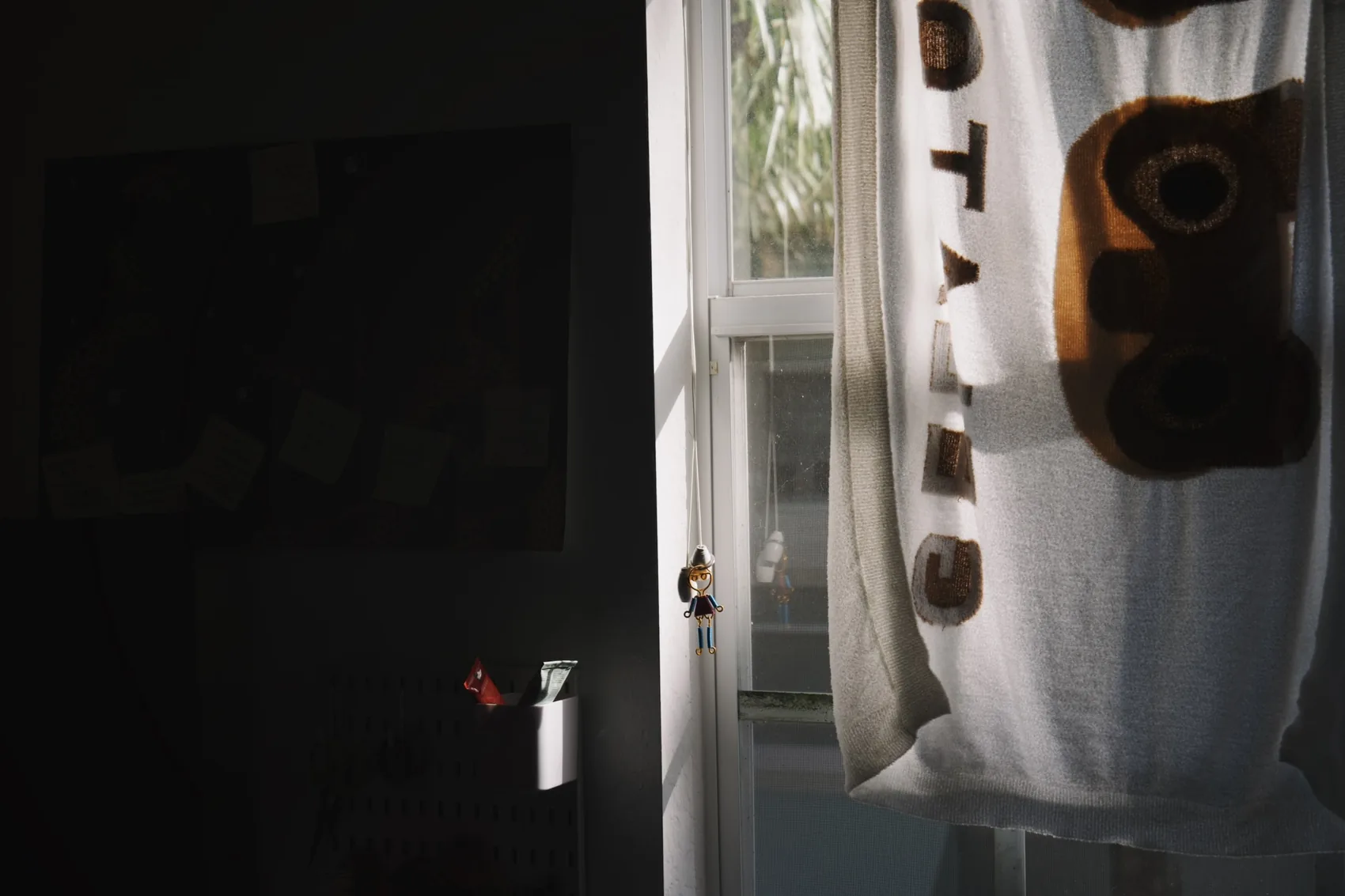A dark Palm Beach Gardens doorway with a towel and narrow light.