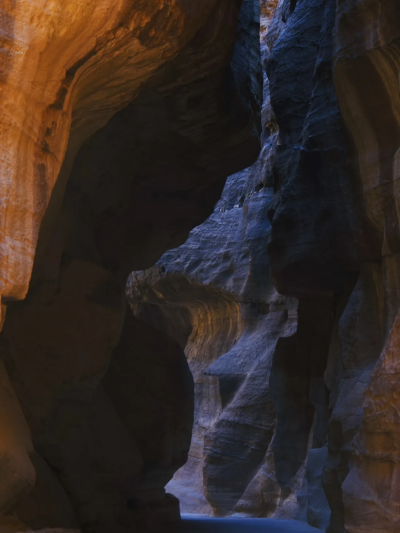 Blue and orange Petra canyon walls.