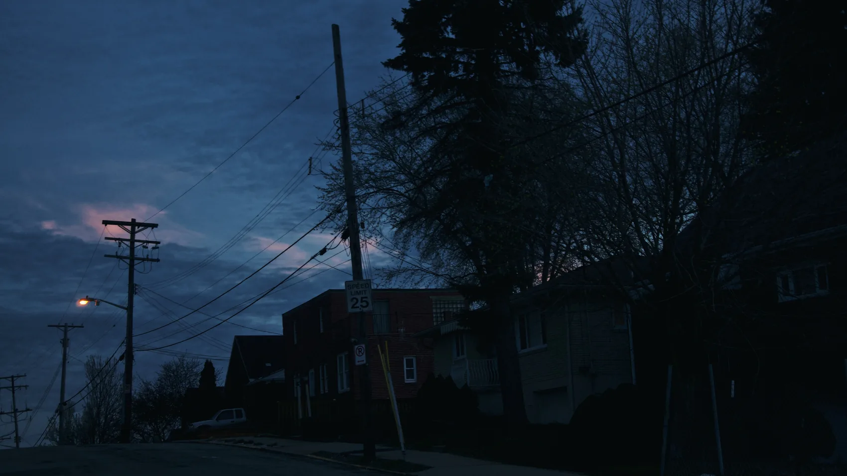 A dark blue Pittsburgh street after sunset.