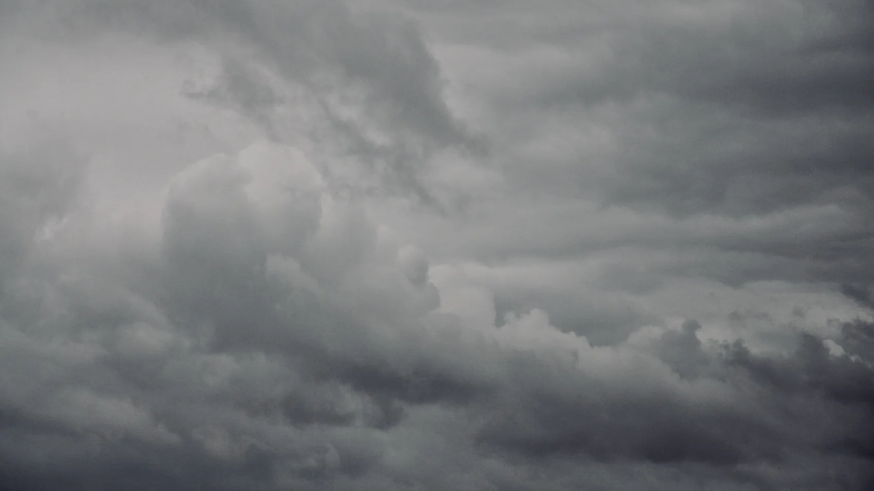 Dark storm clouds over the fields around Stonehenge.